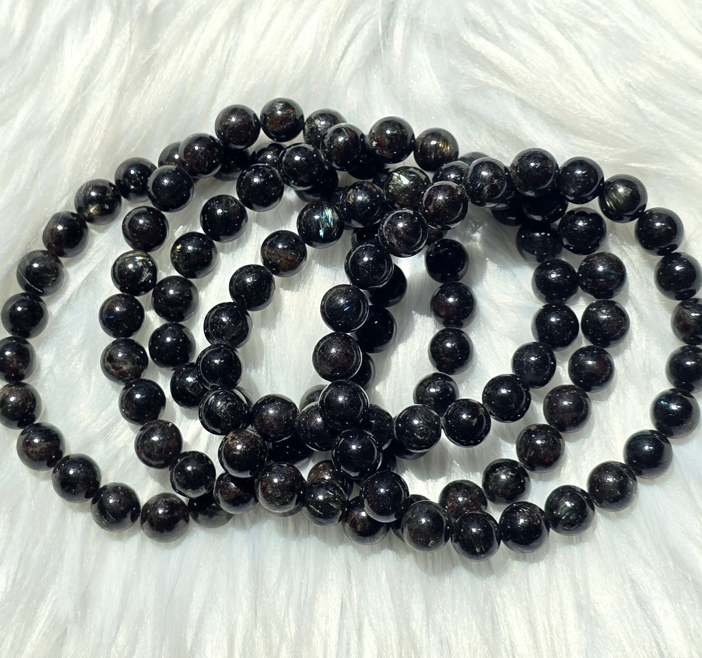 Astrophyllite- endocrine and reproductive support, align chakras, grounding, astral travel, transformation
