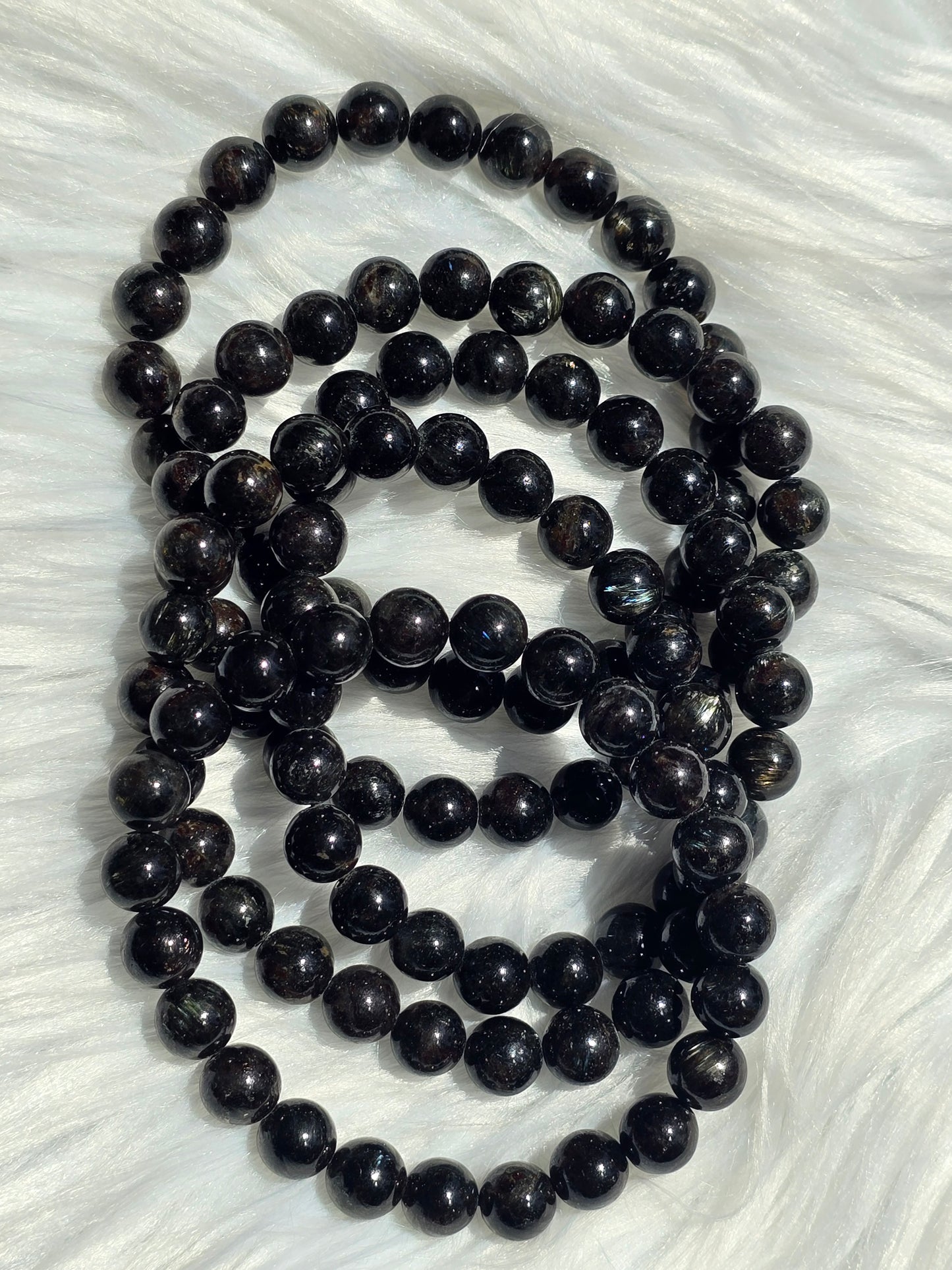 Astrophyllite- endocrine and reproductive support, align chakras, grounding, astral travel, transformation